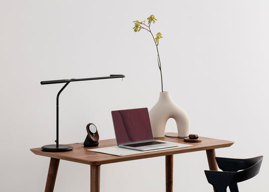 macbook pro on classic wooden desk