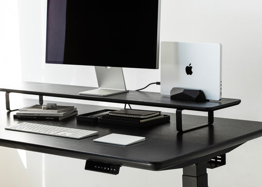 black desk setup with macbook