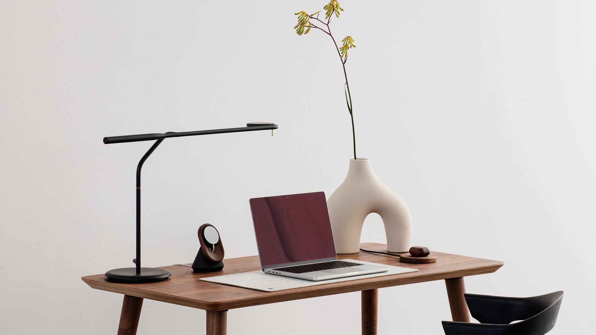 macbook pro on classic wooden desk