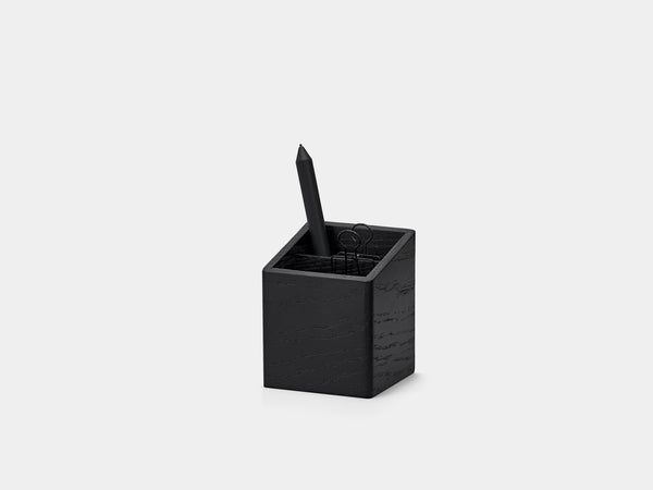 Black pen holder with a black pen on a white background| black