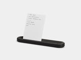 Black tray holding a to-do card on a white background | black