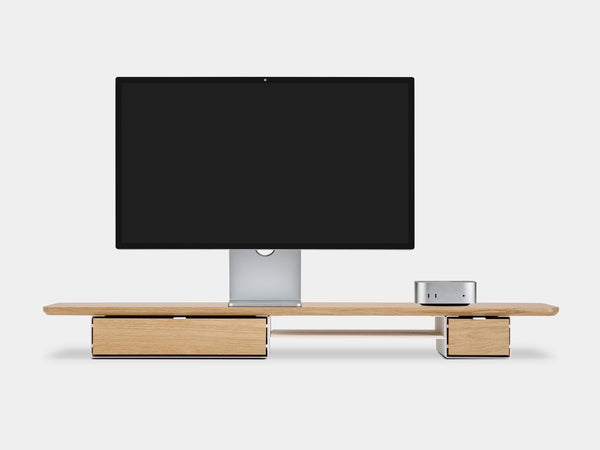 Modern monitor stand  a white background oakywood wooden desk shelf pro with apple display studio and Mac mini, solid wood monitor stand side view | light oak, single drawer, white