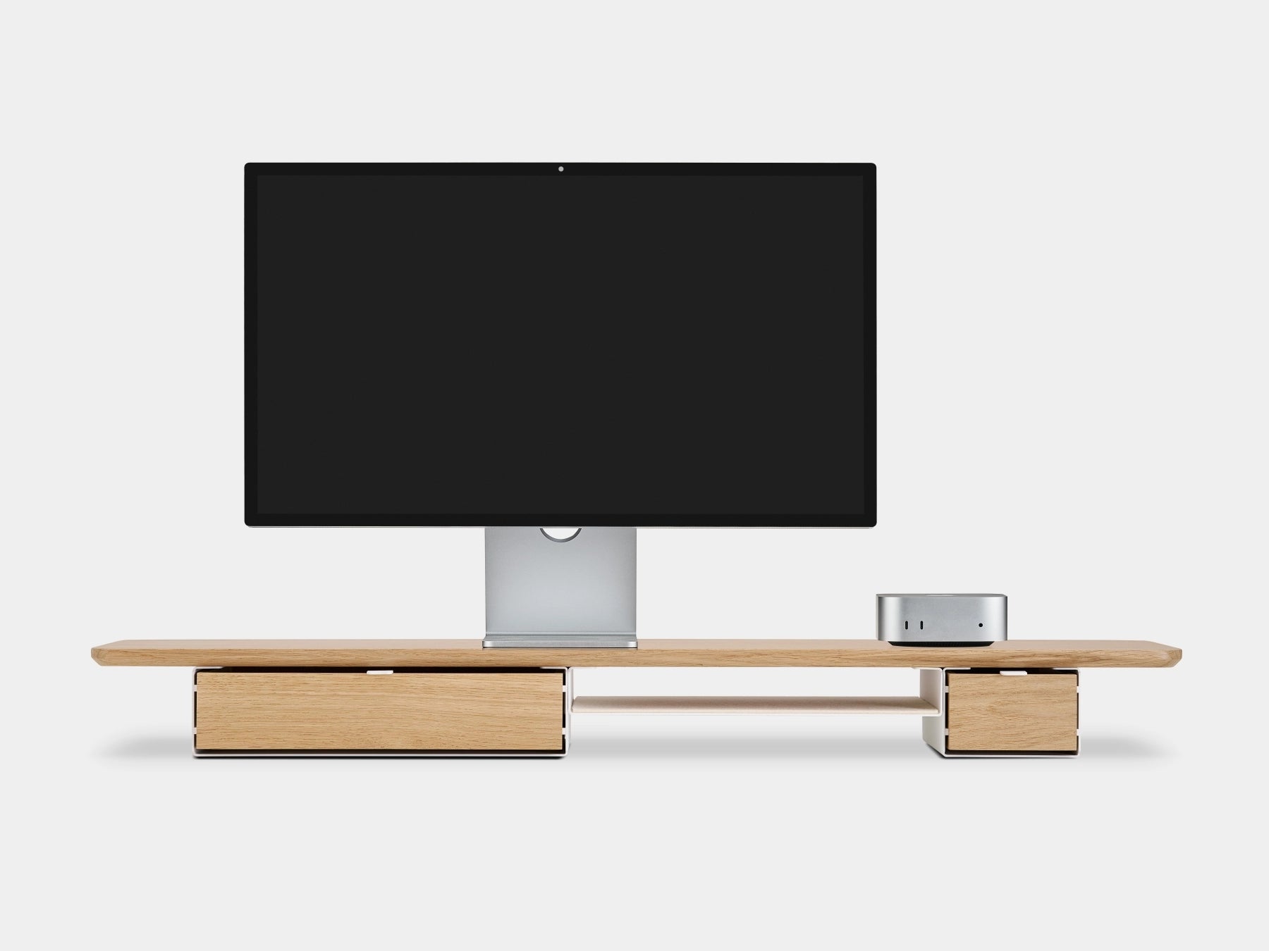 Modern monitor stand  a white background oakywood wooden desk shelf pro with apple display studio and Mac mini, solid wood monitor stand side view | light oak, single drawer, white