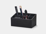 Black desk organizer with office supplies on a white background| black