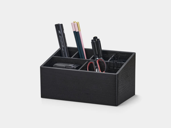 Black desk organizer with office supplies on a white background| black