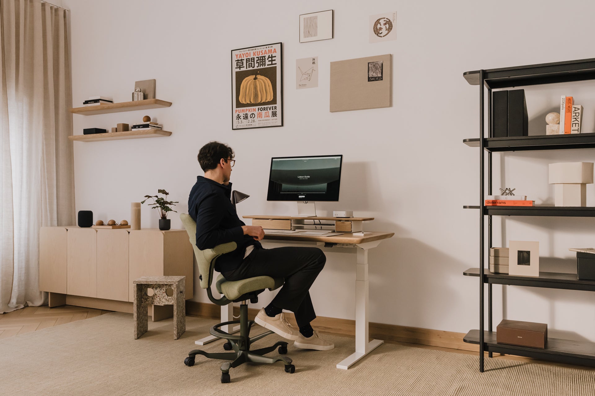 Person sitting at a desk in a home office setting with a computer monitor. |light oak, , 