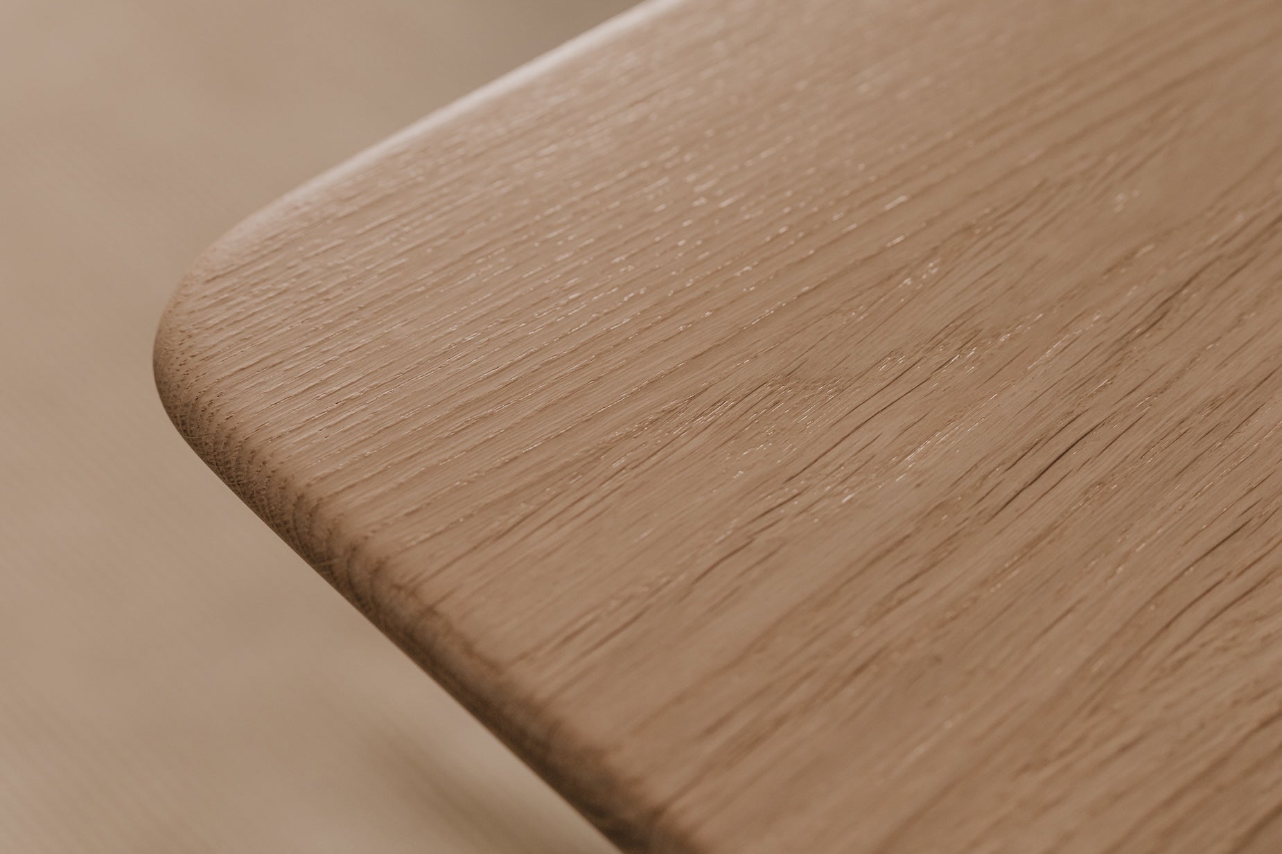 Close-up of a wooden surface with a blurred background  | light oak,