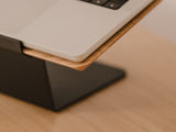 Laptop on a wooden stand with a blurred background | oak,