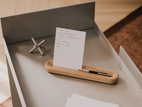 to-do list holder with a pen, small object, and paper on a wooden surface | oak