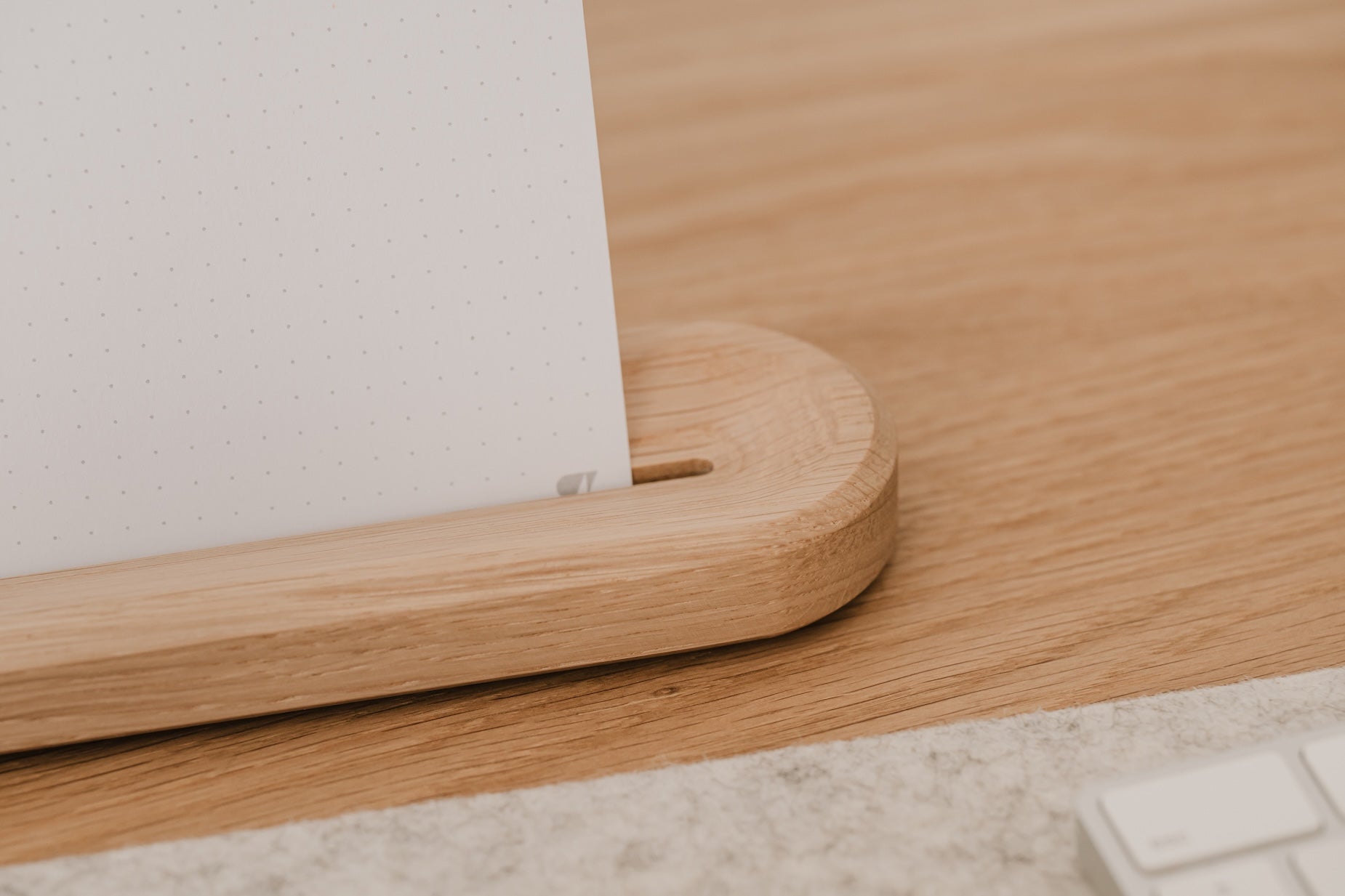 Wooden desk with a white dotted design oakywood to-do cards, placed against a light-colored wall |-