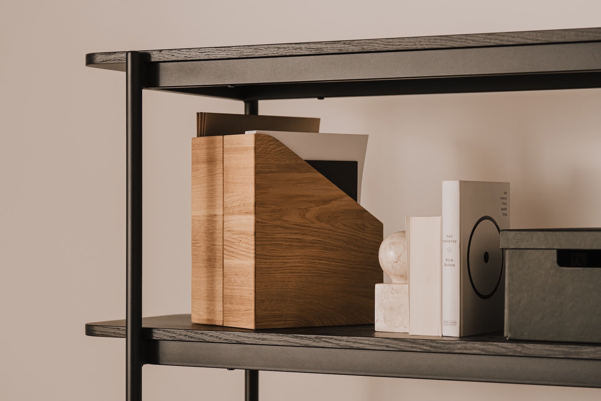 Bookshelf with A4 document holder, books and decorative items against a beige wall | oak