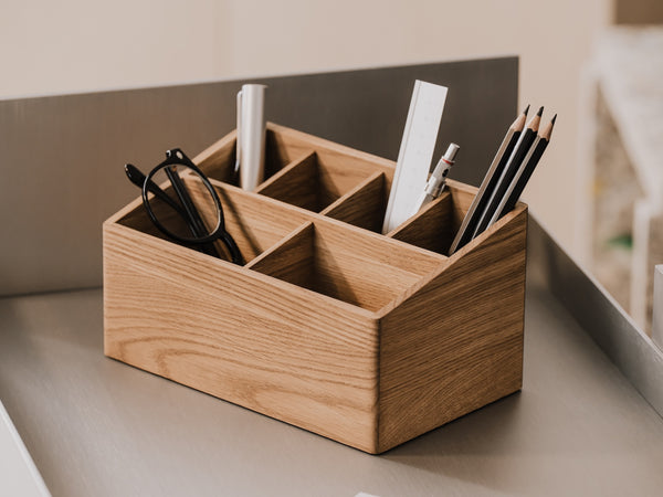 Wooden oak desk organizer with stationery items on a neutral background | oak