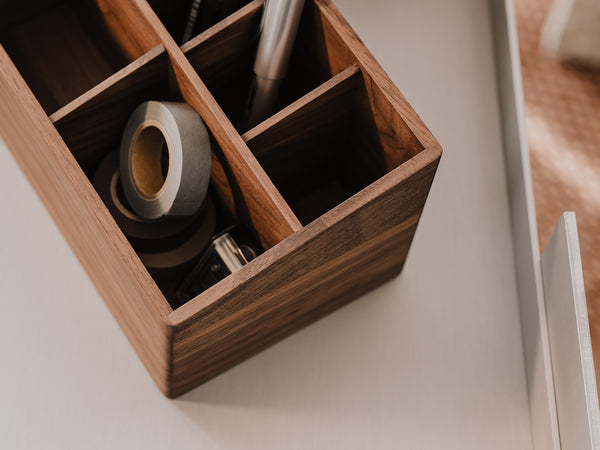 Wooden desk organizer with office supplies on a neutral background | walnut