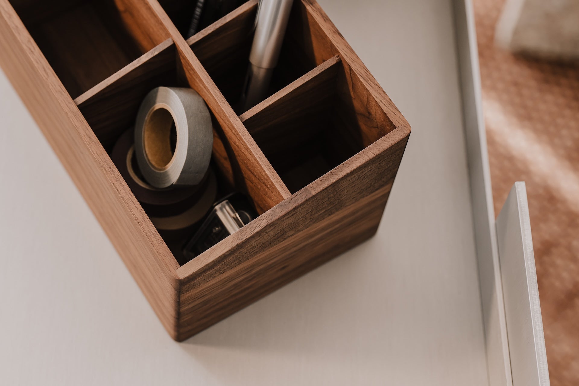 Wooden desk organizer with office supplies on a neutral background | walnut