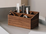 Wooden desk organizer with office supplies on a neutral background | walnut