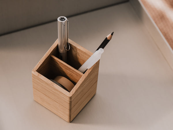 Wooden pen holder with a pen and pencil on a neutral background | oak