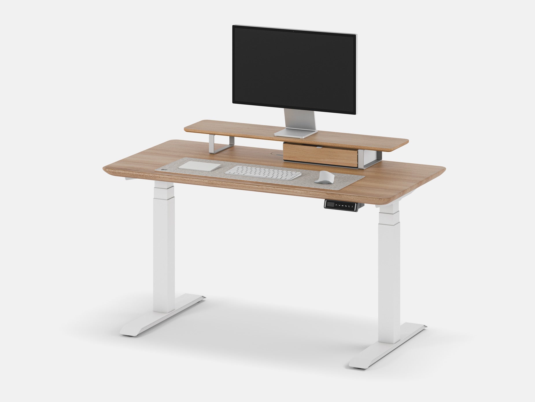 Minimalist desk with wireless keyboard and monitor on raised shelf