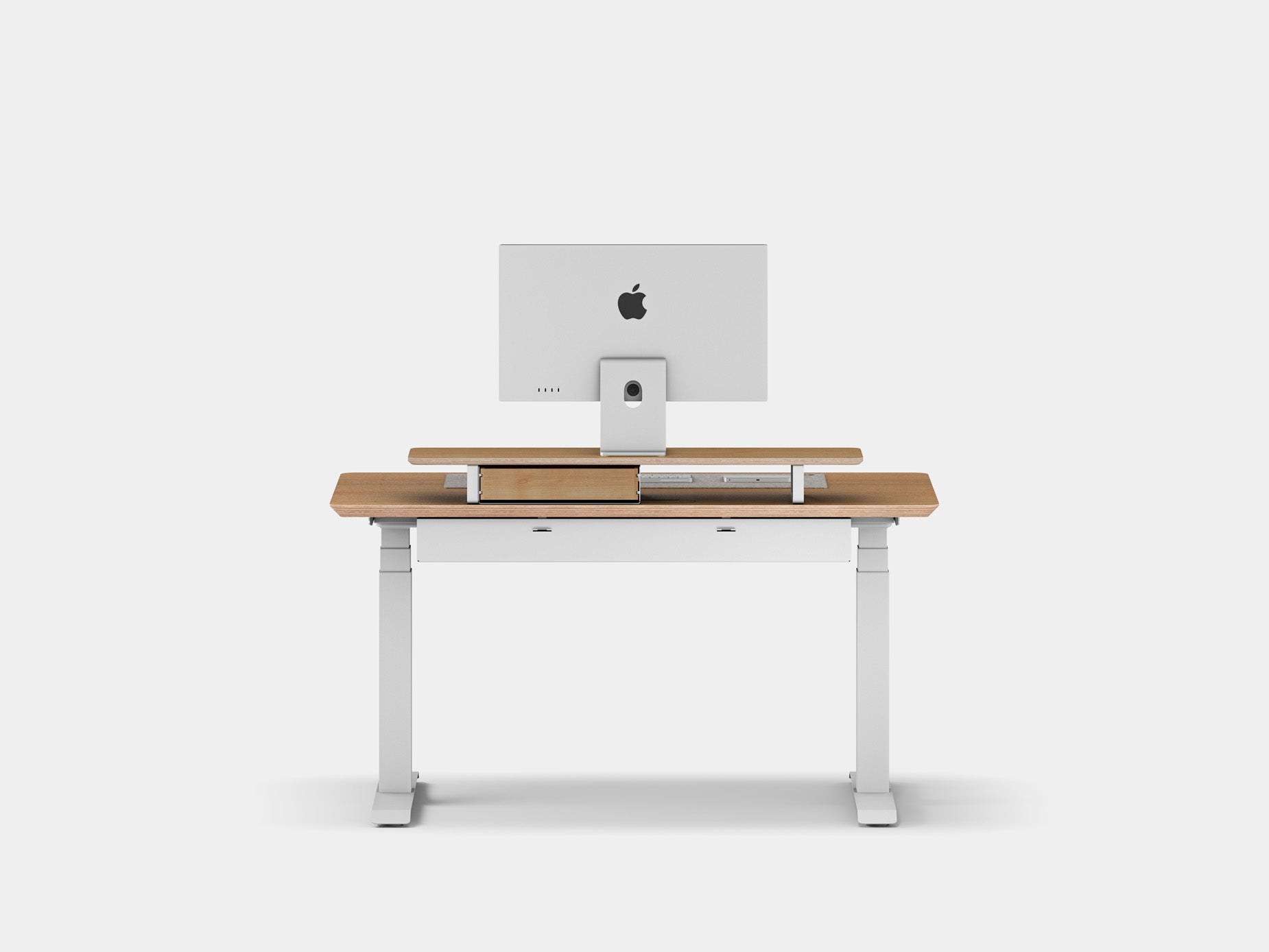 Wide desk with monitor and organized workspace including mouse and keyboard rack