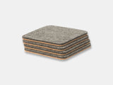 Stack of gray felt coasters on a light gray background oakywood | grey