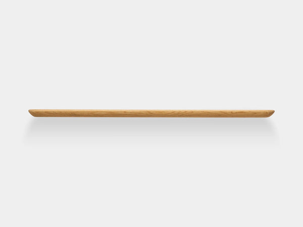 Long wooden shelf with white background, simple design
