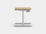 Ergonomic standing desk with wooden top and adjustable base on a white background | light oak, , white
