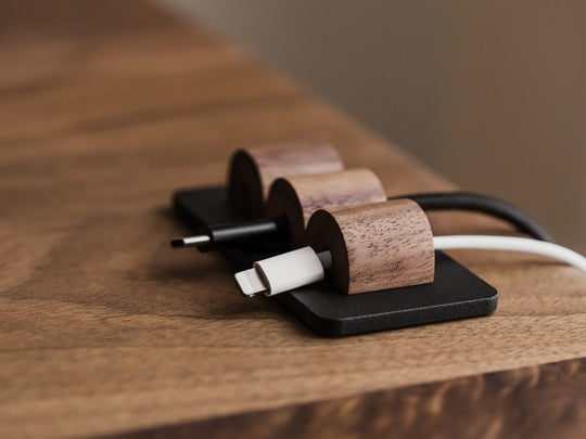 Wooden cable management system on a wooden surface | walnut, 
