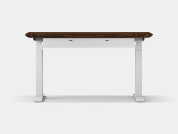 Side view of white and gray electric-height desk with dark wood top and cable management tray