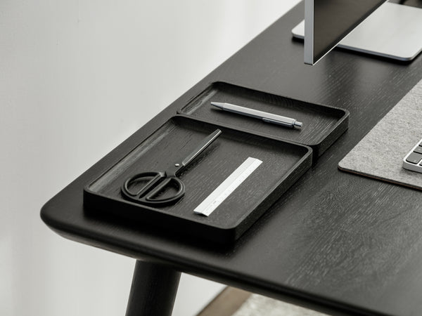 Close-up of a wood desk edge showing fine laminated plywood corner detail